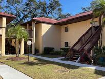 Building exterior showing a walkway, landscaping, and stairs at 1111 W Faith Cir # 2003, Bradenton, FL 34212