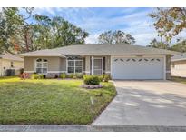 Single-story house with attached garage and well-maintained lawn at 7530 42Nd E Ct, Sarasota, FL 34243