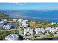 Aerial view of waterfront community, showing building and surrounding landscape at 7840 34Th W Ave # 203, Bradenton, FL 34209