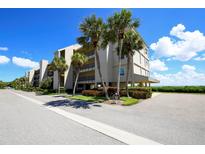 Attractive beachfront condo building with lush landscaping and parking at 4800 Gulf Of Mexico Dr # Ph 3, Longboat Key, FL 34228