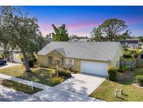 Aerial view of a residential community with numerous houses and a lake at 3229 6Th W Ave, Palmetto, FL 34221