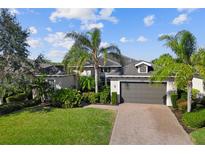 Single-Gathering home with two-car garage and landscaped yard at 942 Preservation St, Bradenton, FL 34208