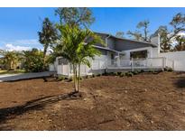 Newly constructed home with a spacious front yard and deck at 1211 N View Dr, Sarasota, FL 34242