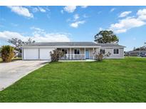 Newly built home with a two-car garage and a spacious lawn at 3915 32Nd W St, Bradenton, FL 34205