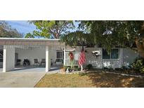 Inviting exterior with carport and landscaped yard at 3935 Panola Ln # 183, Sarasota, FL 34232