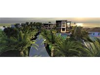Luxury waterfront home with a modern design, showcasing a stunning sunset view at 639 Cornwell On The Gulf, Venice, FL 34285