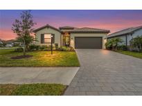 Charming single-story home with a well-manicured lawn and a two-car garage, perfect for suburban living at 5107 Coral Reef Way, Bradenton, FL 34211