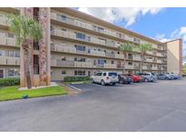Building exterior showcasing ample parking and a well-maintained property at 4460 Ironwood Cir # 403A, Bradenton, FL 34209