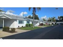 Neatly landscaped community with several single-story homes at 6100 Coral Way, Bradenton, FL 34207