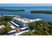 Waterfront condominiums feature a pool, covered parking, and beautiful ocean views at 605 Sutton Pl # 205, Longboat Key, FL 34228