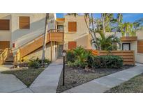 Charming condo with lush landscaping, wood accents, and warm lighting at 144 Wild Palm Dr, Bradenton, FL 34210