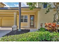 Charming home featuring a beautiful front door, lush landscaping, and a welcoming entrance at 4708 Clipper Dr, Bradenton, FL 34208