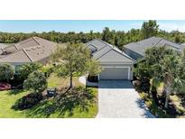 Charming home with a two-car garage, paver driveway, and well-maintained landscaping at 5023 Tobermory Way, Bradenton, FL 34211