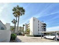 Condo building with tropical landscaping, convenient parking and a serene atmosphere at 5740 Midnight Pass Rd # 307, Sarasota, FL 34242
