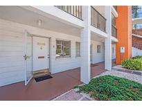 Condo entrance featuring a white door, white siding, and a small outdoor area at 5889 Canal Dr # I4, Bradenton, FL 34207