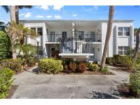 Charming condo with well-maintained landscaping, balcony, and updated entry at 755 Village Cir # 203, Venice, FL 34292