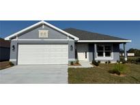 Charming single-story home featuring a two-car garage, and well-maintained landscaping at 2640 Averland Loop, North Port, FL 34287