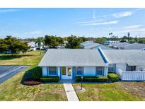Charming single-story villa with neat landscaping and a concrete walkway leading to the front door at 3701 39Th W St, Bradenton, FL 34205