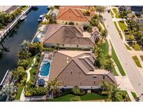 Stunning waterfront homes featuring private pools and lush landscaping with direct canal access at 579 Fore Dr, Bradenton, FL 34208