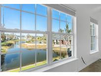 Bright window with a view of the community pond and pool at 5711 Soldier Cir # 204, Sarasota, FL 34233