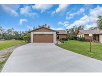 Charming single-story home featuring an attached two car garage, and a spacious driveway at 1817 Curry Ave # 57, Nokomis, FL 34275