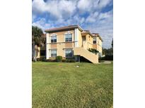 Beautiful two-story condo with well-manicured lawn and lush landscaping at 2950 Viscaya Pl # 205, Sarasota, FL 34237