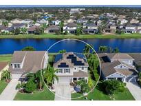 Stunning two-story home features solar panels and a gorgeous waterfront view of a picturesque lake at 4617 Garden Arbor Way, Bradenton, FL 34203