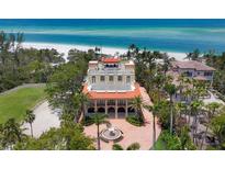 Stunning beachfront mansion with well-manicured landscaping and beautiful ocean views at 1067 Westway Dr, Sarasota, FL 34236