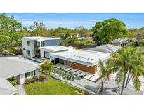 Stunning modern home featuring clean lines, wood accents, meticulous landscaping, and an inviting open design at 2149 Hyde Park St, Sarasota, FL 34239