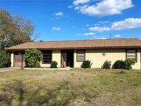 Charming single-story home with a well-maintained yard and a welcoming entryway in a cozy neighborhood at 3252 Patton St, Sarasota, FL 34235