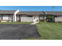 Charming townhome featuring a well-maintained lawn and paved driveway at 3403 36Th W St # 109, Bradenton, FL 34205