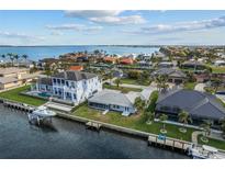 Waterfront homes boast private docks and stunning water views in this coastal neighborhood at 23 Ocean Dr, Punta Gorda, FL 33950
