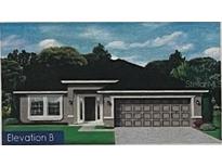 Charming single-story home featuring a two-car garage, welcoming entrance, and well-maintained landscaping at 2668 Averland Loop, North Port, FL 34287