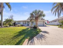 Charming single-story home with well manicured lawn and beautiful landscaping at 3672 Pine Rd, Venice, FL 34293
