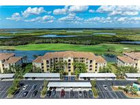 Beautiful condo building overlooking a golf course, lake and nature preserve at 7019 River Hammock Dr # 104, Bradenton, FL 34212