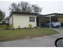 Charming single-story home with a carport and well-maintained lawn at 6227 Green View Cir # 77, Sarasota, FL 34231