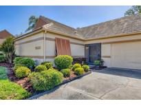 Charming one-story home with well-maintained landscaping, neutral tones, and a lovely tile roof at 3522 57Th Avenue W Cir, Bradenton, FL 34210