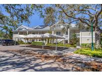 Inviting condominium with covered parking, lush landscaping, and charming balconies at 3803 54Th W Dr # 203, Bradenton, FL 34210