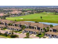 A beautiful residential complex with a manicured golf course view provides luxury living at 5710 Palmer Cir # 105, Bradenton, FL 34211