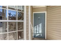 Close-up of a unit's front door with house number and a window showing the reflection of trees at 850 S Tamiami Trl # 301, Sarasota, FL 34236