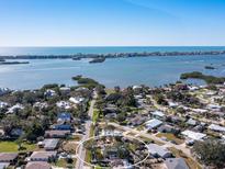 Stunning aerial view of the home and neighborhood near the ocean at 1705 Wharf Rd, Sarasota, FL 34231