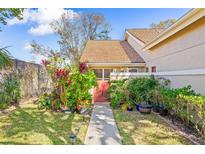 Beautifully landscaped yard with a charming garden and walkway at 5727 Monte Rosso Rd, Sarasota, FL 34243