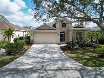 Charming single-Gathering home with a two-car garage and well-manicured landscaping at 1113 Cane Mill Ln, Bradenton, FL 34212