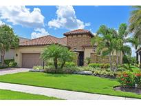 Beautiful single-Gathering home with lush landscaping, stone accents, and a barrel tile roof at 13214 Treviso Dr, Bradenton, FL 34211