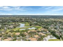 Scenic aerial view of the golf course community with lush landscaping, ponds, and beautiful Florida homes at 3864 Chatsworth Greene Ct # 10, Sarasota, FL 34235
