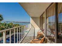 Enjoy panoramic water views from this private balcony with seating area overlooking beautiful scenery at 500 N Osceola Ave # 203, Clearwater, FL 33755