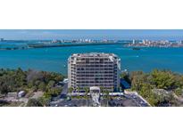 Modern condo with large windows overlooking the bay, city, and lush greenery at 500 N Osceola Ave # 203, Clearwater, FL 33755