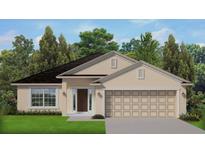 Charming single-story home with a well-manicured lawn, attached two-car garage and inviting front entrance at 2675 Averland Loop, North Port, FL 34287