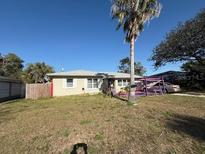 Charming single-story home with a well-maintained front yard and mature trees at 1217 Tyrone N Blvd, St Petersburg, FL 33710