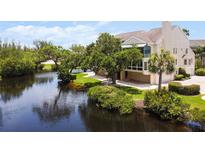 Beautiful waterfront property with lush landscaping and private dock at 121 Tidy Island Blvd, Bradenton, FL 34210